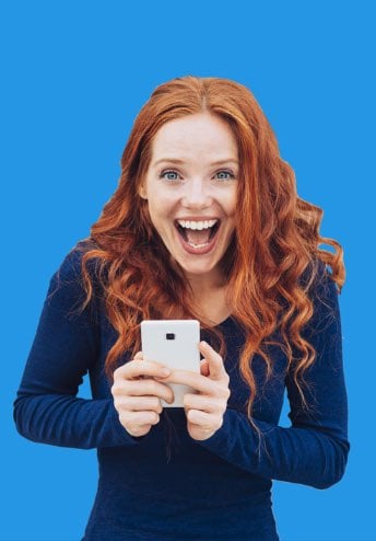 Excited woman in dark blue shirt holding a smartphone