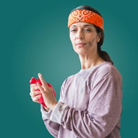 Woman in headband with grease stains on her