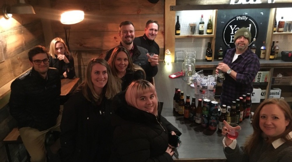 Square 2 team members celebrating at a pop-up bar
