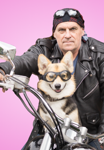 Man and his dog on a motorcycle ready to go fast