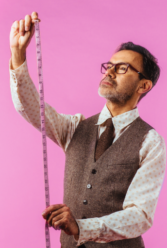 Man with measuring stick checking for growth