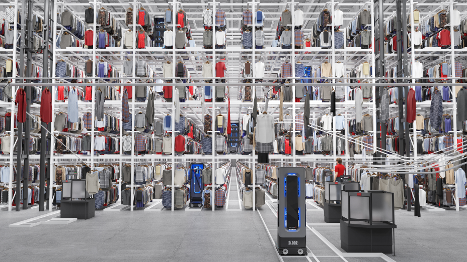 Clothing hanging from ceiling to floor at a warehouse